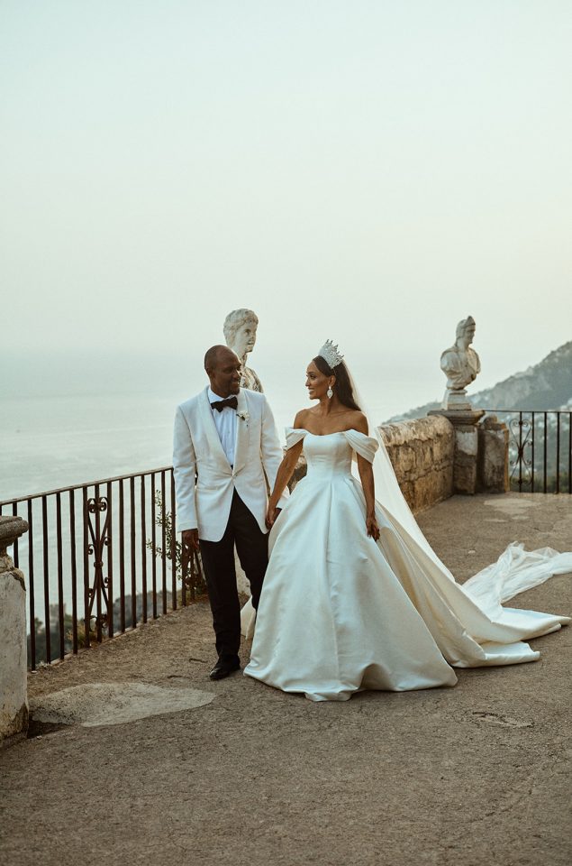 Bride and groom walking on the infiniti terrace in Ravello at Villa Cimbrone